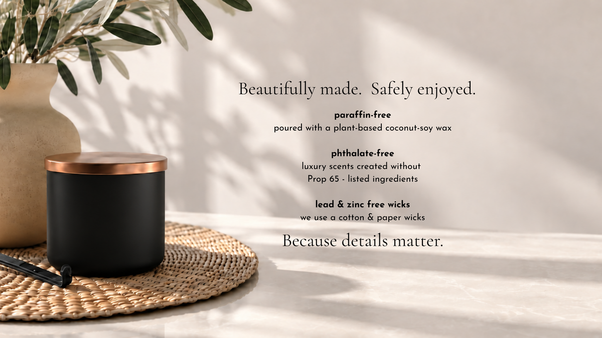 A matte black scented candle jar with a metallic copper lid sits on a woven placemat next to a vase with greenery. Text on the right highlights product benefits: paraffin-free, phthalate-free, lead and zinc free wicks, and beautifully made, safely enjoyed.